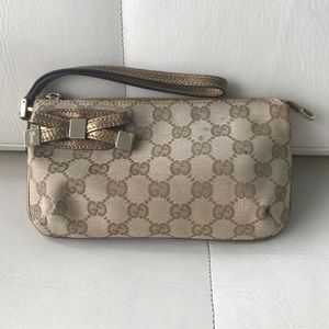 Gucci Monogram Gold Bow Wristlet
